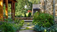 rustic garden path with flower beds either side