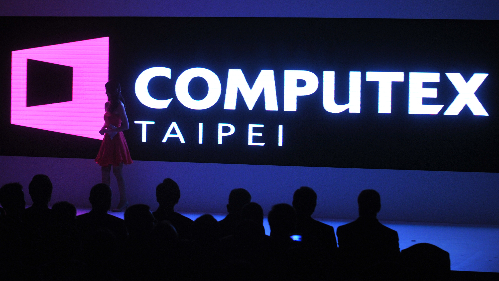 Computex logo behind a woman on stage