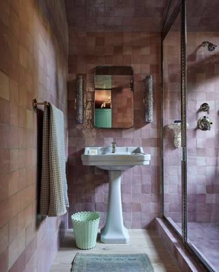 pink bathroom with zellige tiles