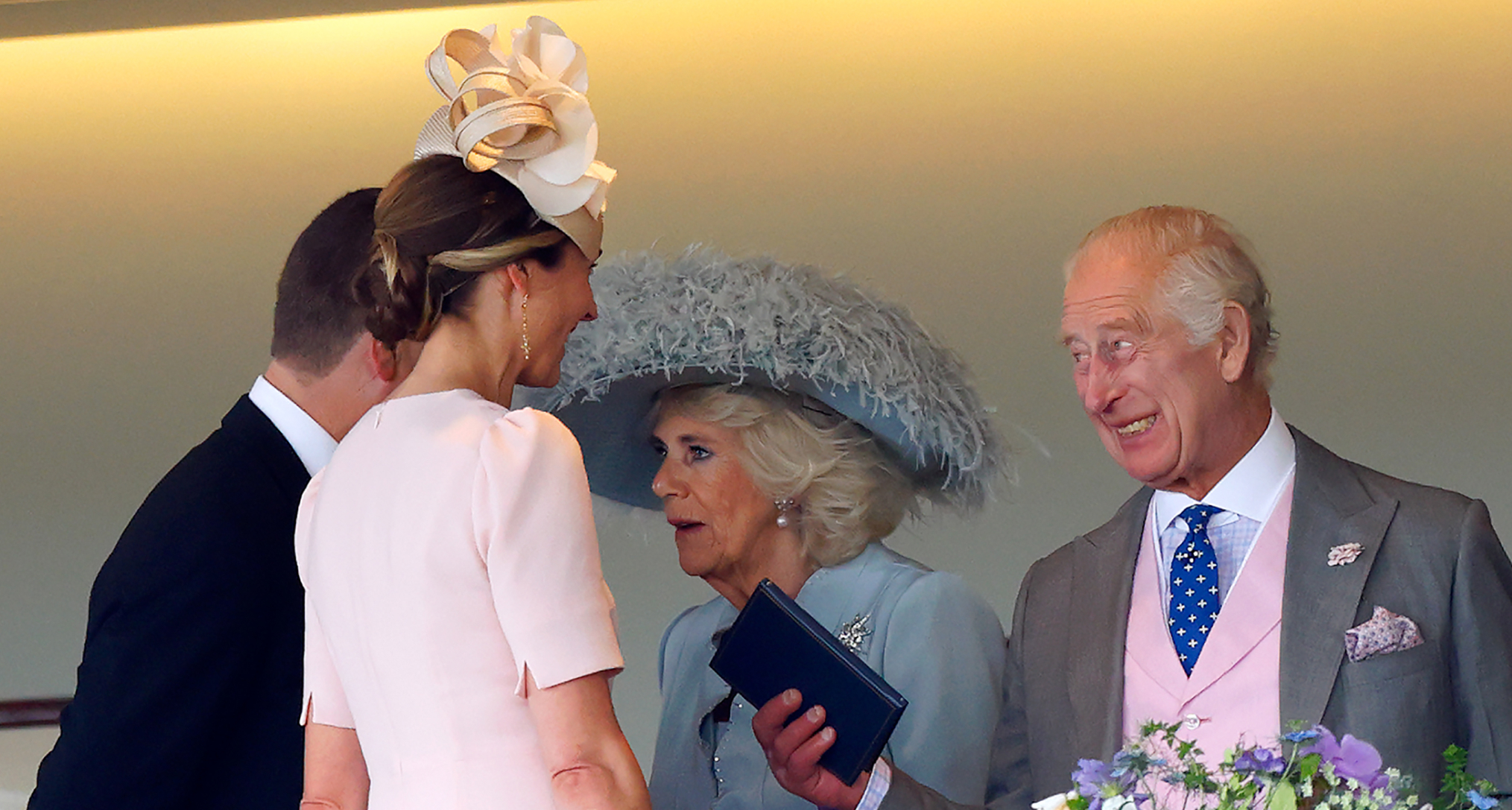 King Charles and Queen Camilla talking to Harriet Sperling and Peter Phillips at Ascot