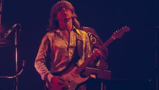 Mick Ralphs performs onstage with Bad Company at Earl's Court in London in July 1977