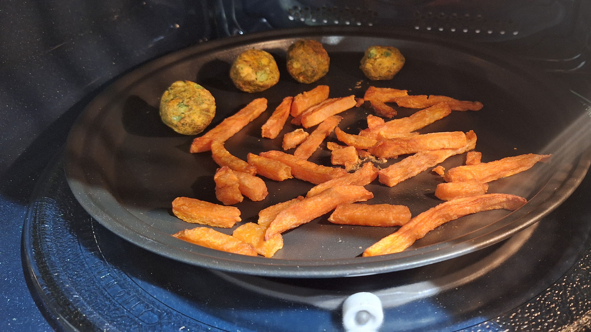 Food being cooked in the Samsung Combi Smart Microwave