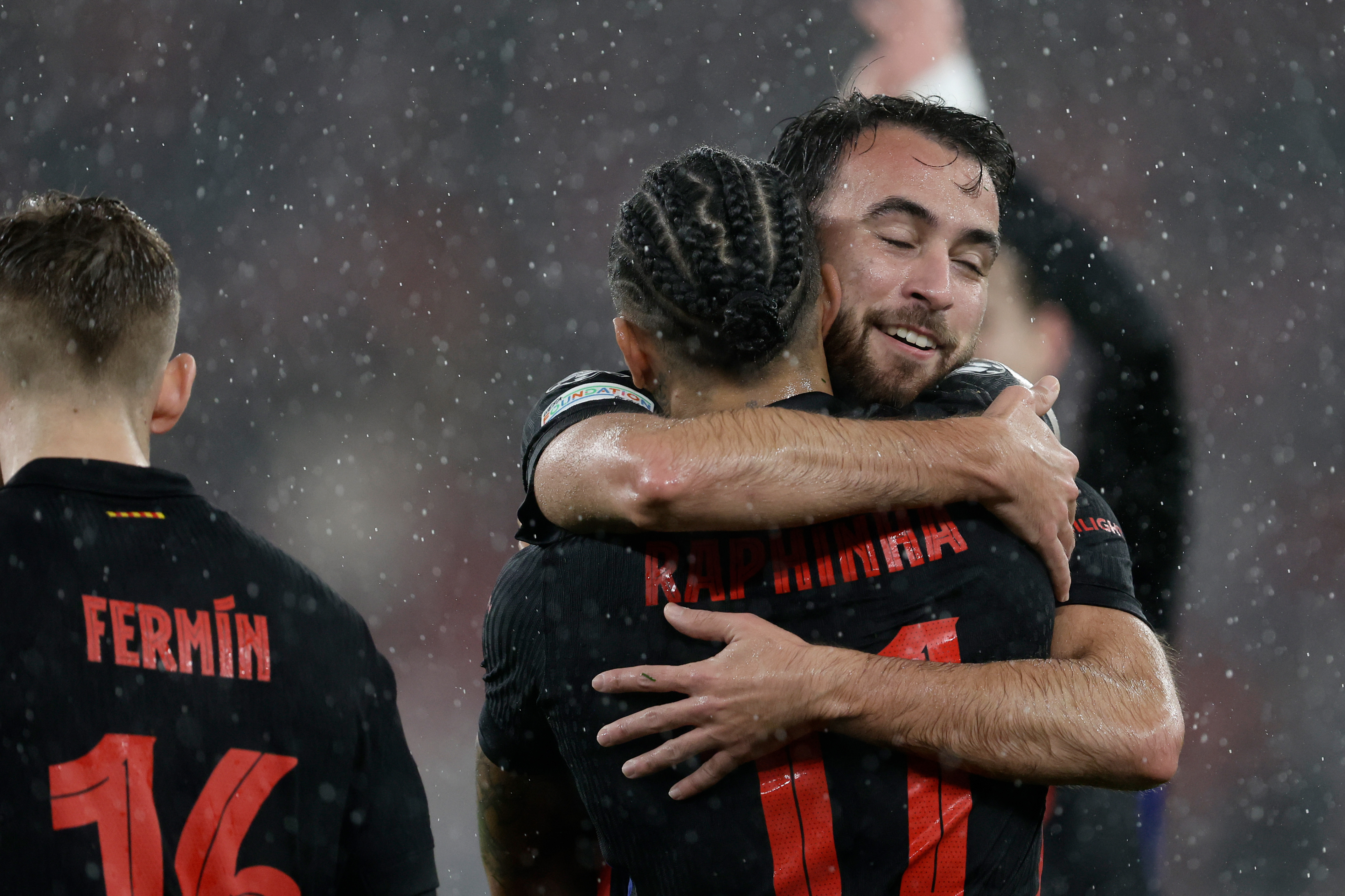 Eric Garcia celebrates with Raphinha after Barcelona's 5-4 win over Benfica in the Champions League in January 2025.