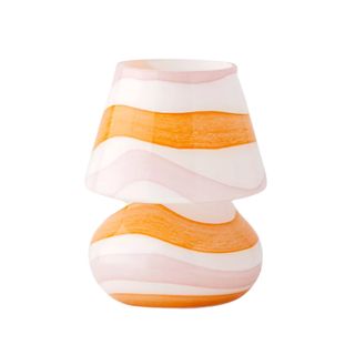 A pink and orange glass table lamp