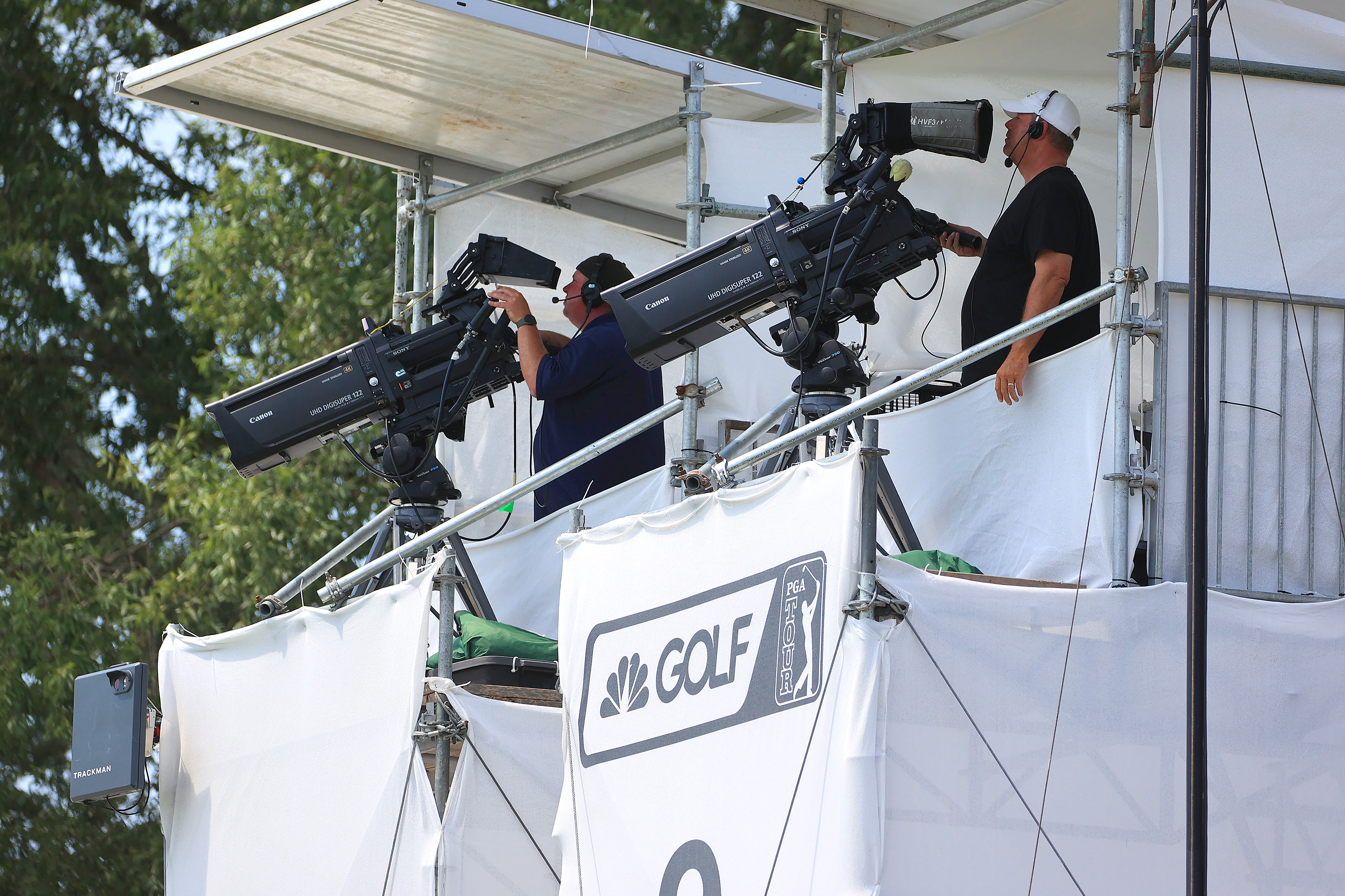 Two camera operators in a tower for Golf Channel during a PGA Tour event