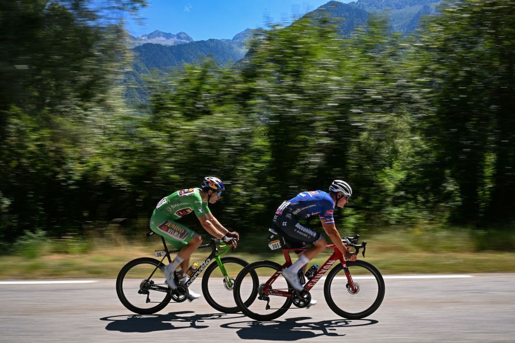 Alpecin Deceuninck teams Dutch rider Mathieu Van Der Poel R and JumboVisma teams Belgian rider Wout Van Aert wearing the sprinters green jersey L cycle in a breakaway during the 11th stage of the 109th edition of the Tour de France cycling race 1517 km between Albertville and Col du Granon Serre Chevalier in the French Alps on July 13 2022 Photo by AnneChristine POUJOULAT AFP Photo by ANNECHRISTINE POUJOULATAFP via Getty Images
