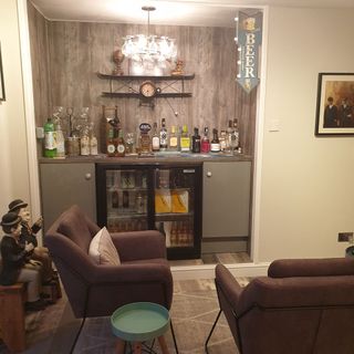 living room with drinks fridge and sofa