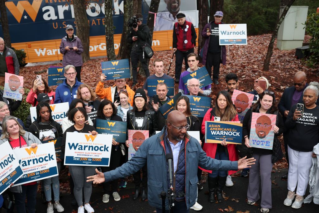 Raphael Warnock speaks to crowd.