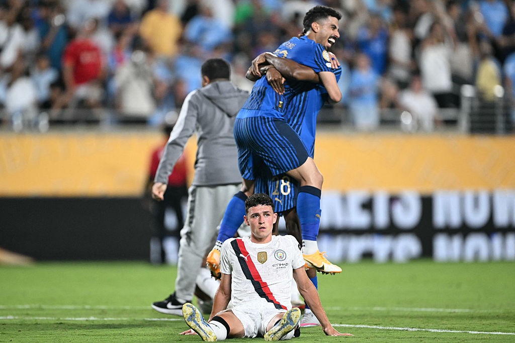 Manchester City's English midfielder #47 Phil Foden reacts while players of Al-Hilal celebrate at the end of the FIFA Club World Cup 2025 round of 16 football match between England's Manchester City and Saudi's Al-Hilal at the Camping World stadium in Orlando on June 30, 2025.