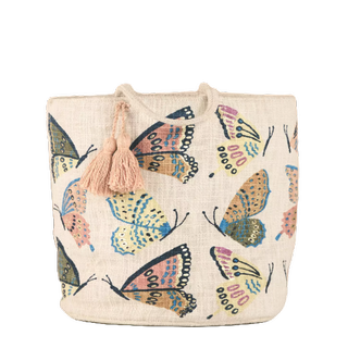 a fabric storage basket with handles in a butterfly print