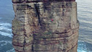 Jesse Dufton climbing Old May of Hoy