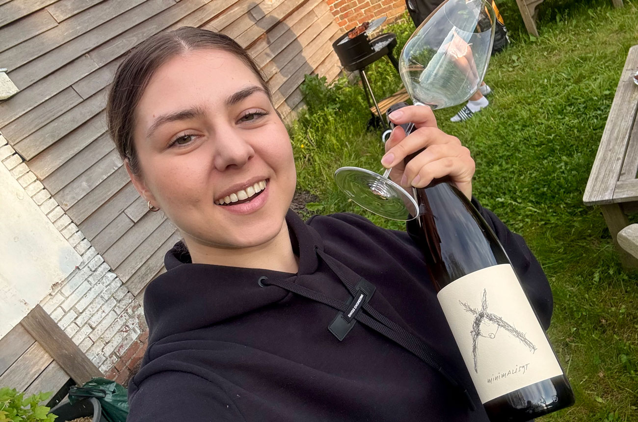 Daria Volokitina with a glass and bottle of Austrian Furmint