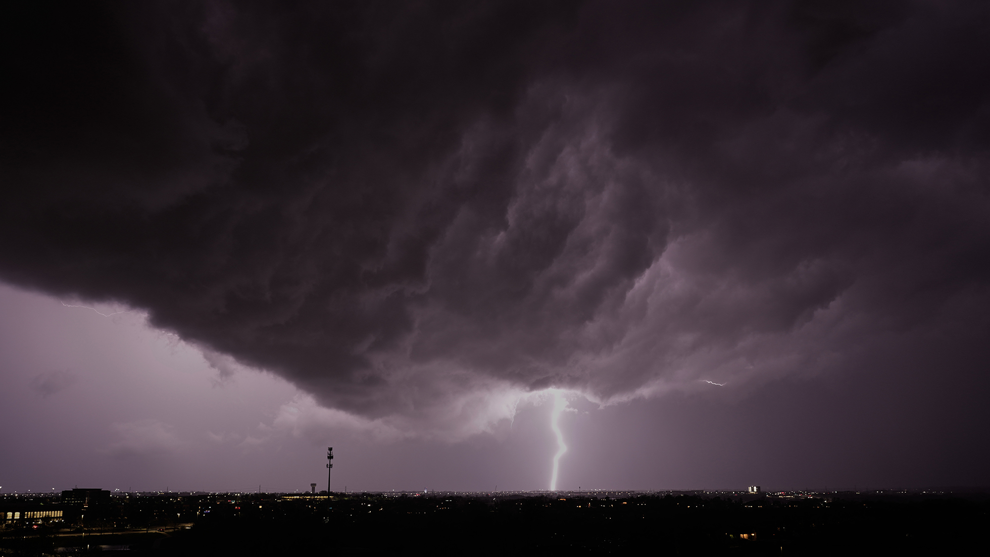 Lightning flashes as a storm clouds pass over Lenexa, Kansas