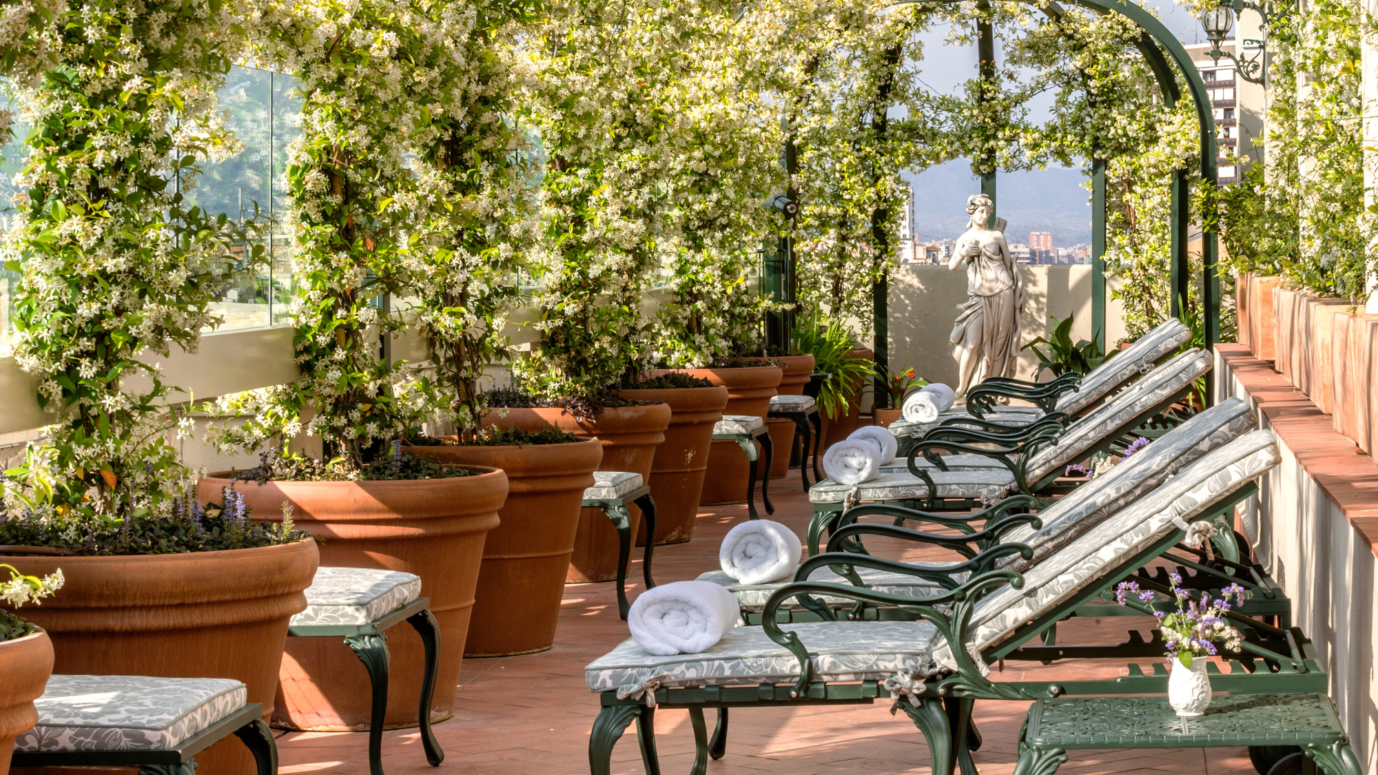 Hotel El Palace Barcelona terrace with a row of sun lounger chairs