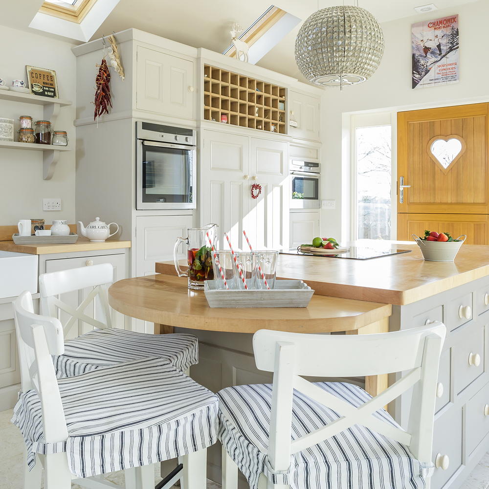 kitchen with dining area with dining sets and teal cabinets