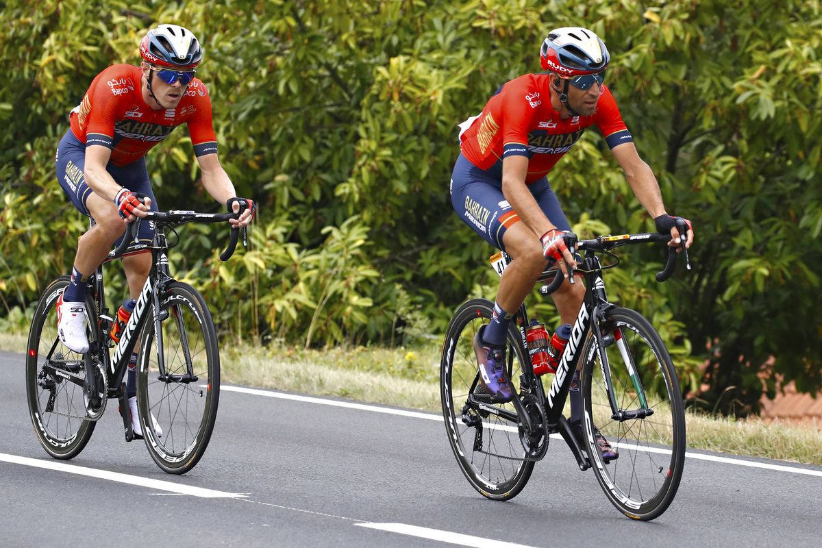 Rohan Dennis and Vincenzo Nibali ride in the peloton during stage 12