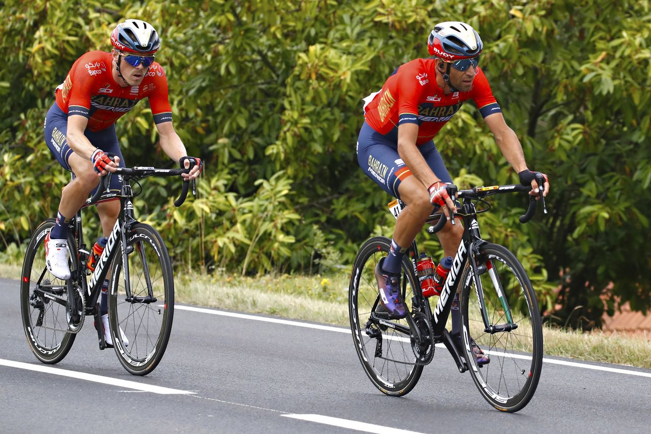 Rohan Dennis and Vincenzo Nibali ride in the peloton during stage 12