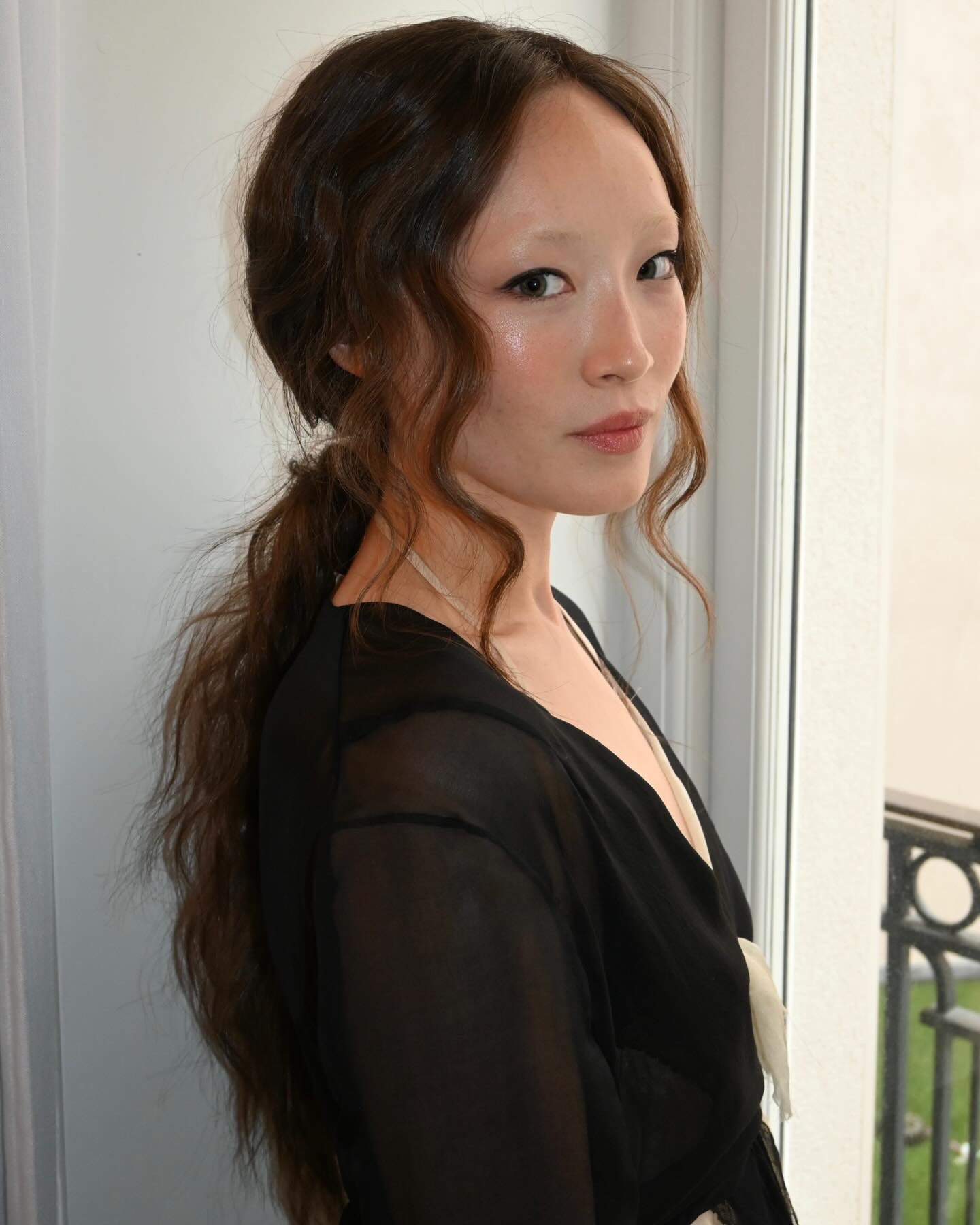 Havana Rose Liu with curly low ponytail