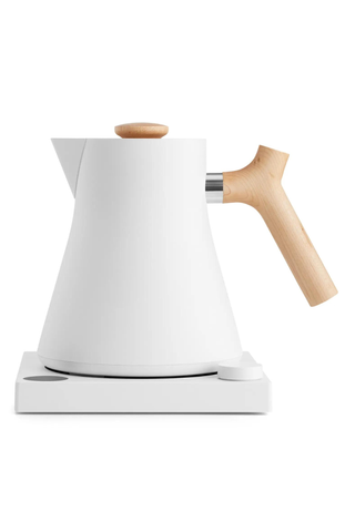 white kettle with light wooden handle