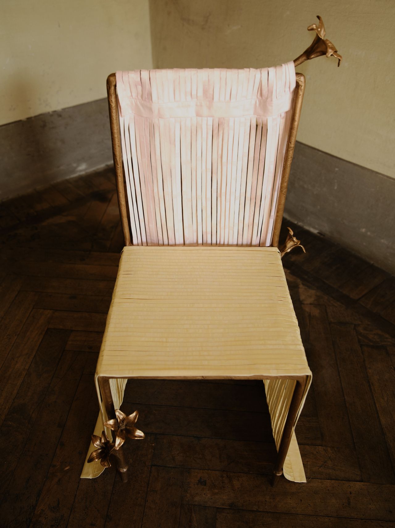 bronze furniture draped in pastel ribbons