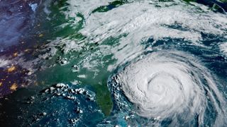 a large white swirl of clouds off the us east coast