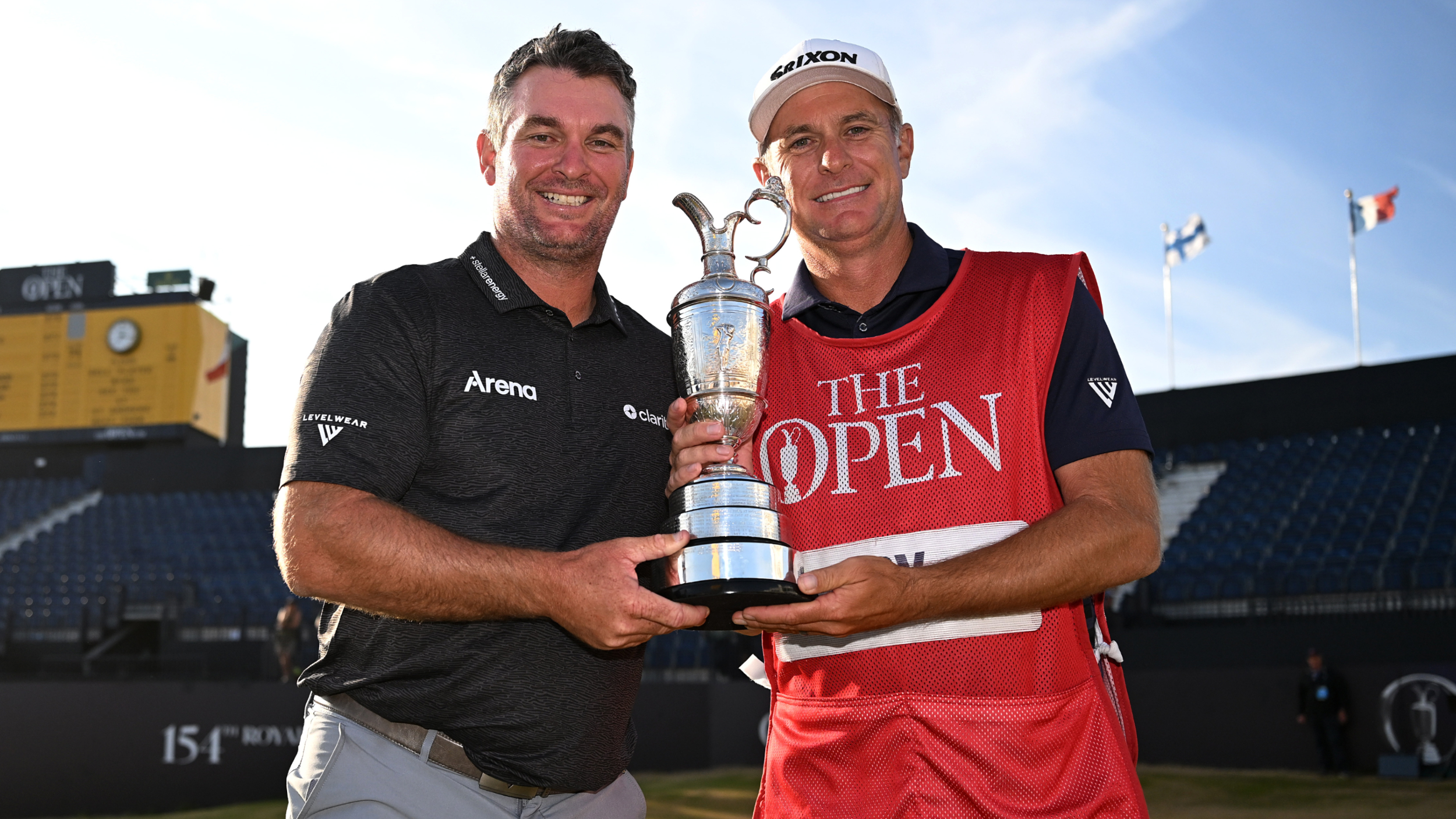 Ryan Fox and Dean Smith holding the Claret Jug