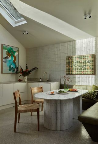 a kitchen with a tiled dining table