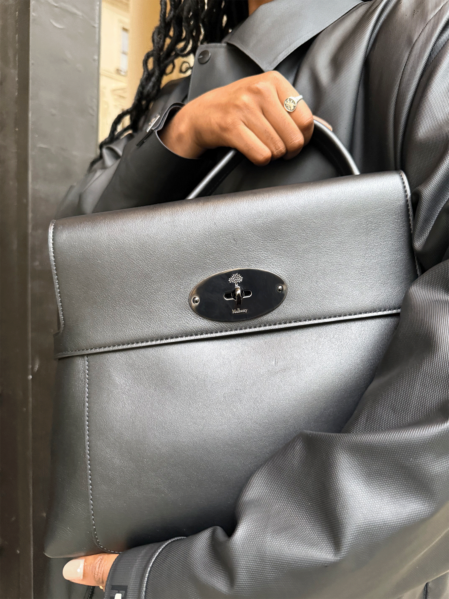 A fashion editor styles the Mulberry Stevie Top Handle in Black Supple Smooth Leather