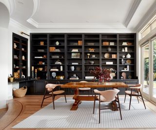 dining room with black built-in shelving