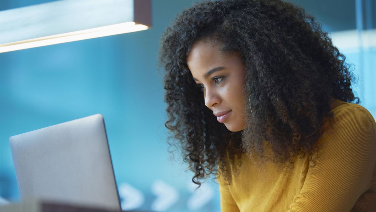 Woman studying on laptop