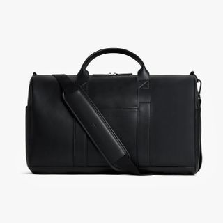 A black vegan leather Metro Carry-all Duffel by Monos