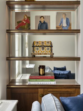 A bookshelf with a mirror background