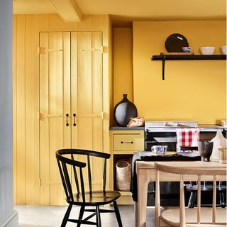 yellow kitchen with dining table