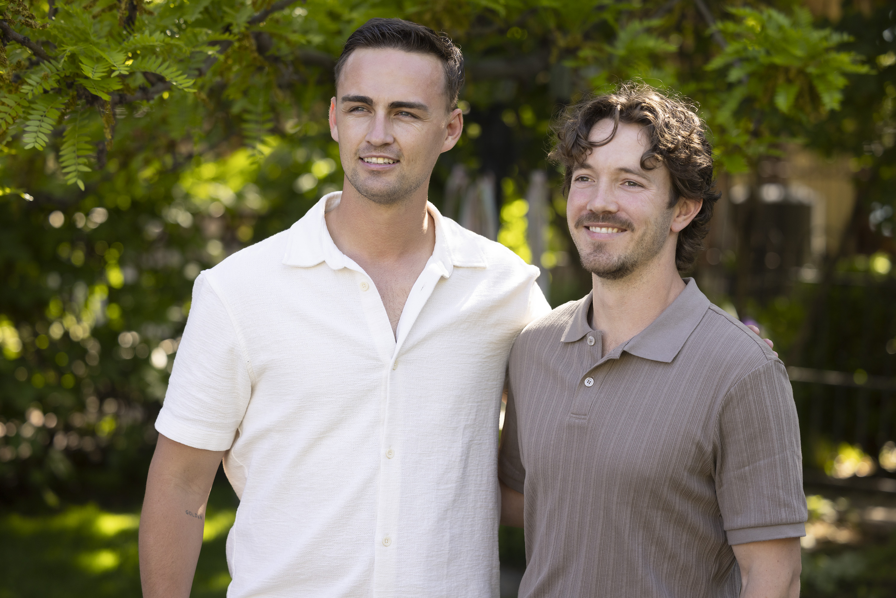 JACOB NEELEY and JACE TERRY pose together while wearing button down polos in the secret lives of mormon wives season 3