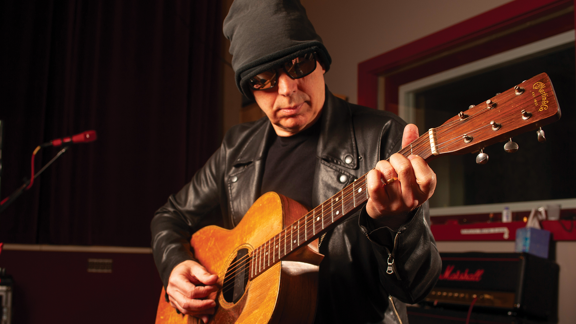 Joe Satriani poses with his 1948 Martin 000-21 in 2020 (circa February/March)
