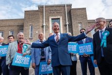 ROMFORD, ENGLAND - MAY 08: Reform UK leader Nigel Farage poses with winning councillors outside Havering Town Hall