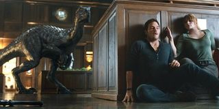 Chris Pratt and Bryce Dallas Howard as Owen and Claire hiding from a dino in Jurassic World: Fallen