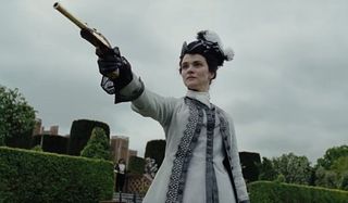 The Favourite Rachel Weisz aims a dueling pistol with malicious intent