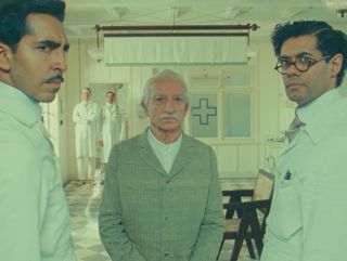 Imdad Khan (Ben Kingsley) with Richard Ayoade and Dev Patel.