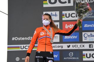 OOSTENDE BELGIUM JANUARY 31 Podium Aniek Van Alphen of The Netherlands Silver Medal Celebration Mask Covid Safety Measures Flowers during the 72nd UCI CycloCross World Championships Oostende 2021 Women U23 UCICX CXWorldCup Ostend2021 CX on January 31 2021 in Oostende Belgium Photo by Luc ClaessenGetty Images