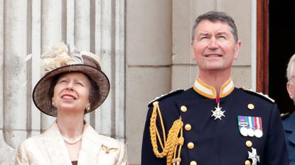 Princess Anne, Princess Royal and Vice Admiral Sir Tim Laurence watch a flypast to mark the centenary of the Royal Air Force from the balcony of Buckingham Palace on July 10, 2018 in London, England