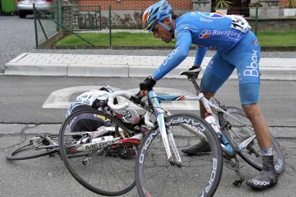 Damien Gaudin (BBox Bouygues Telecom) untangles his bike from Geert Steurs (Topsport Vlaanderen - Mercator) after a crash.