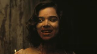 Hailee Steinfeld flashing a bloody smile in Sinners