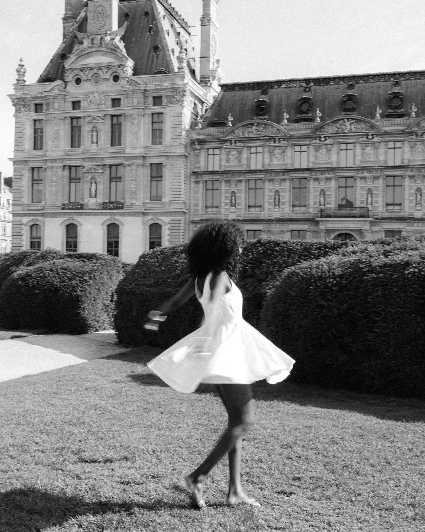 An image of @emmanuellek_ wearing a short white wedding dress.