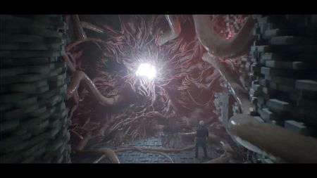Screenshot from Post Trauma, showing a man staring up at fleshy appendages spewing out of a bright white hole in a wall.