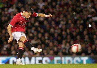 Cristiano Ronaldo scores a free-kick for Manchester United against a Europe XI at Old Trafford in 2007.
