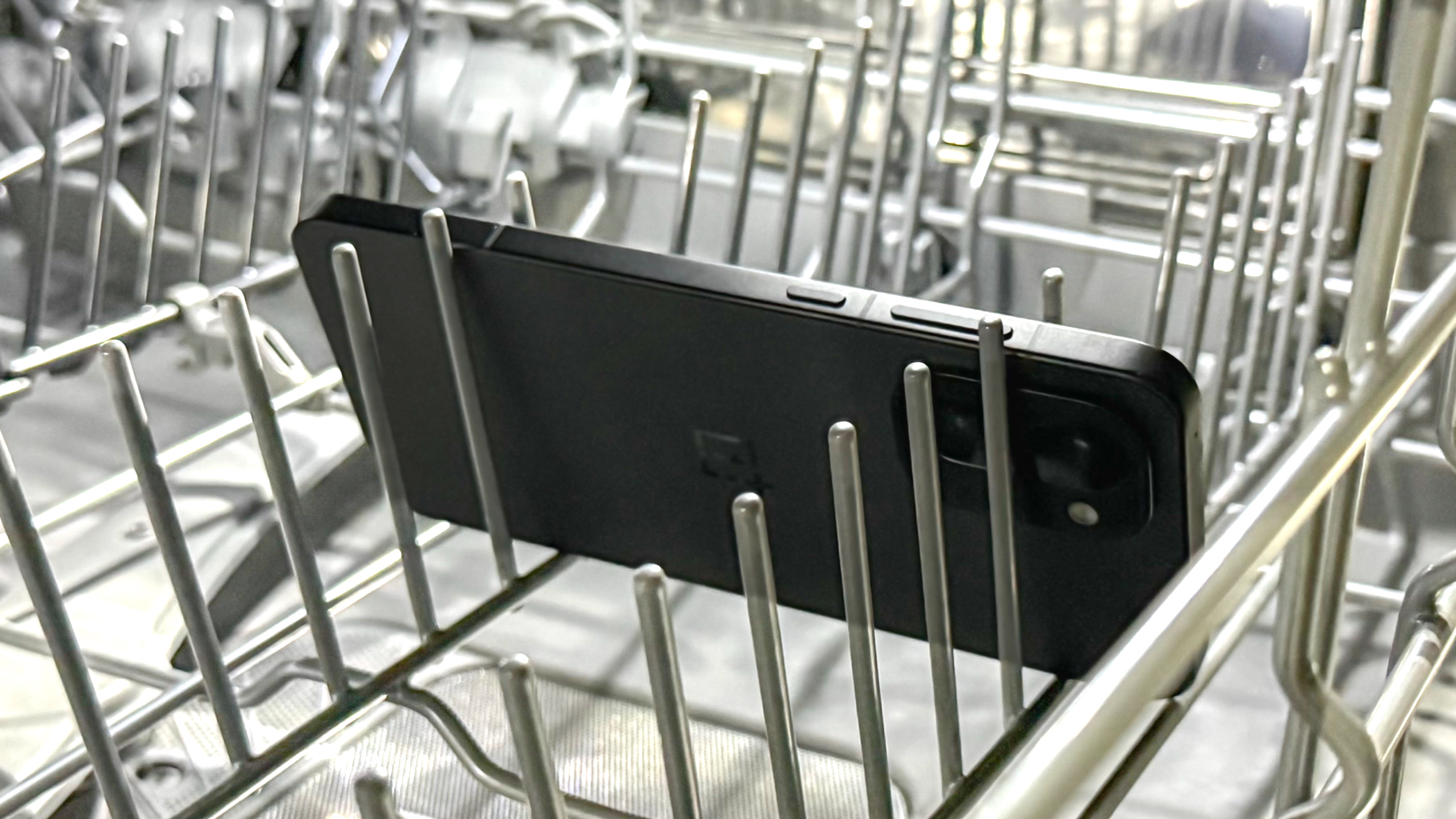 OnePlus 15R in a dishwasher rack