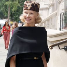 Pamela Anderson wearing leopard-print pillbox hat