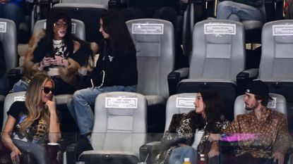 Khloe Kardashian, Winnie Harlow, Justin Bieber, and Hailey Bieber attend Super Bowl LVIII