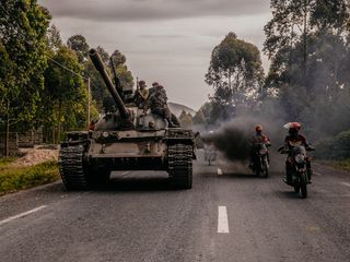Tanks rolling as motorbikes pass, from the Sony World Photography Awards 2023